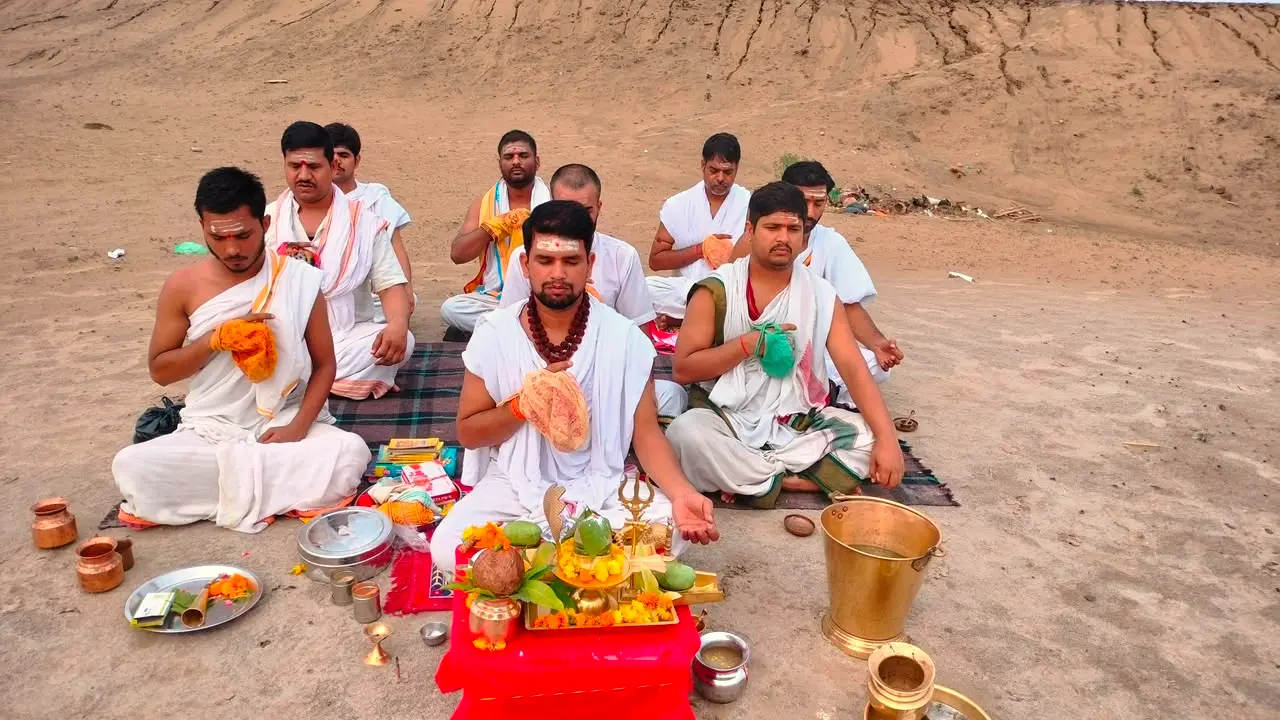 Priests performing a group Vedic Yagya on the riverbank at Lakshmi Narayan Ashram