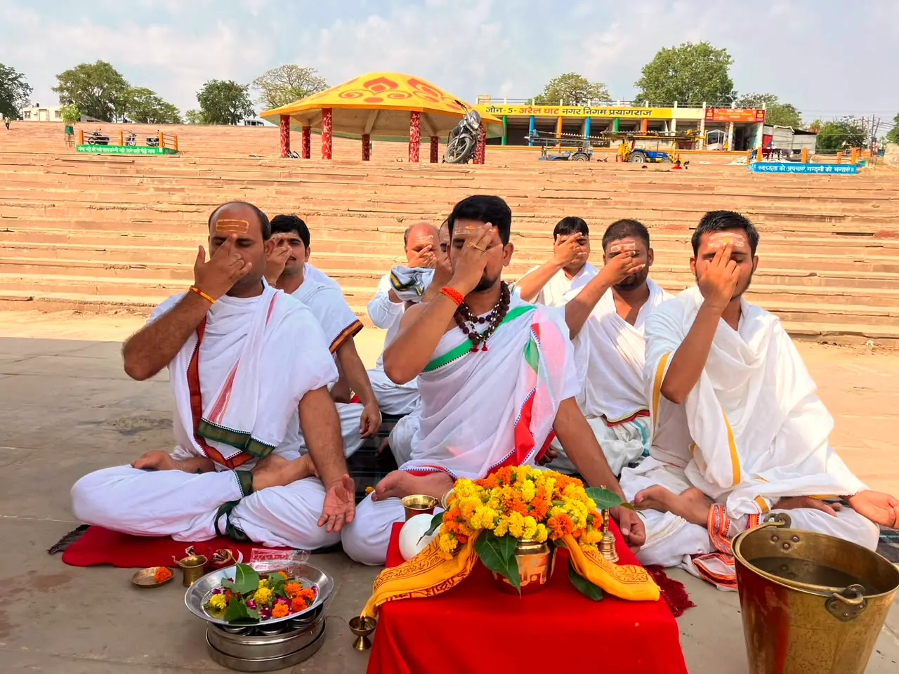A ghat on the riverbank at Prayagraj, where priests gather for Vedic ceremonies